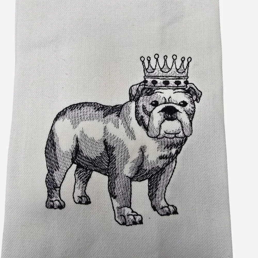 White cotton tea towel with black line drawing of a bulldog wearing a crown